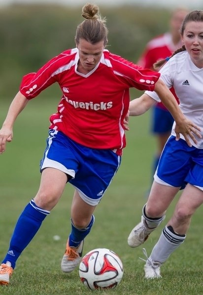 ON THE BALL &#8211; Natalie Miller of Mavericks 09 plays the ball while chased by a Sturgeon player in the Alberta Soccer Association Tier 3 final Monday. Miller scored twice 