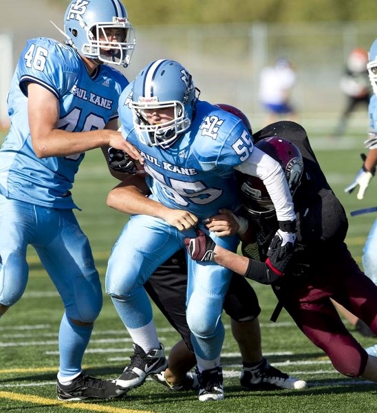 JUNIOR JAMBOREE &#8211; Brandon Crisp of the Paul Kane Blues hangs onto the football