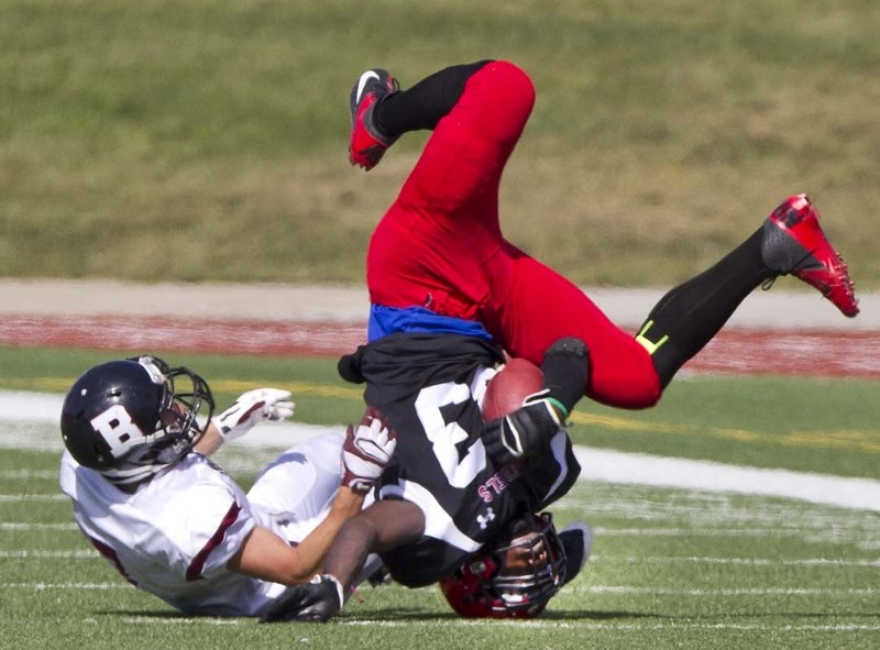 BALANCING ACT &#8211; Seth Waselenchuk of the Bellerose Bulldogs upends Carlos Tekum of the Jasper Place Rebels