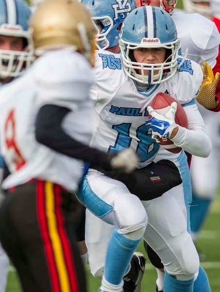 CARRYING THE ROCK &#8211; Paul Kane Blues quarterback Brendan Guy goes for a run against the Strathcona Lords in the Miles division two contest Wednesday at Johnny Bright