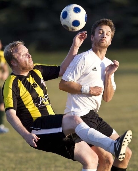 AIR BALL &#8211; Alex Sinclair (left) of SA United and Kyle Greschuk of GSE &lt;br /&gt;play the ball in the St. Albert Men&#8217;s Soccer League semifinal Tuesday at