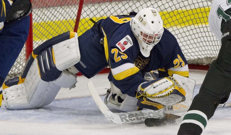 PUCK COVERAGE &#8211; Sam-Jaxon Visscher smothers the puck for the St. Albert Raiders in Wednesday&#8217;s midget AAA exhibition against the Sherwood Park Kings at Akinsdale