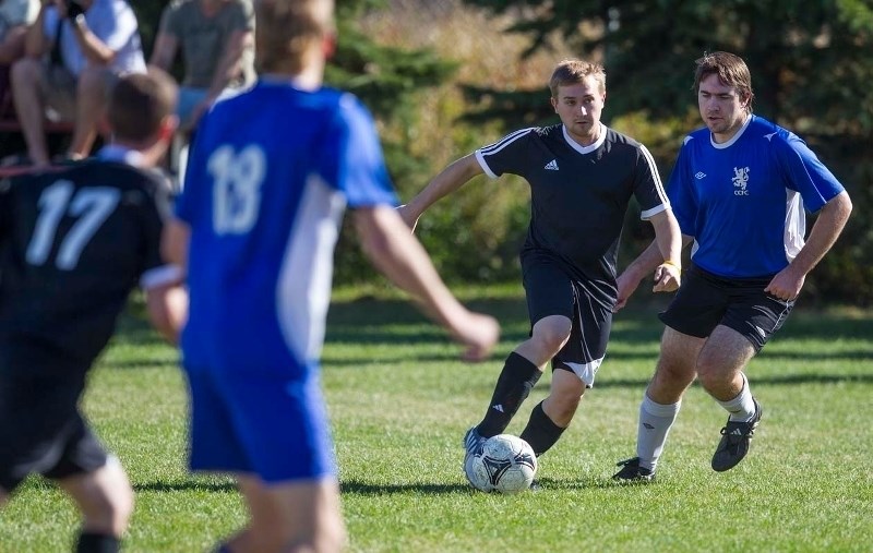 FOOTWORK &#8211; GSE player Curtis Mostowich works the ball while pressured by Daniel Johns of Chester City in the St. Albert Men&#8217;s Soccer League final Sunday at the