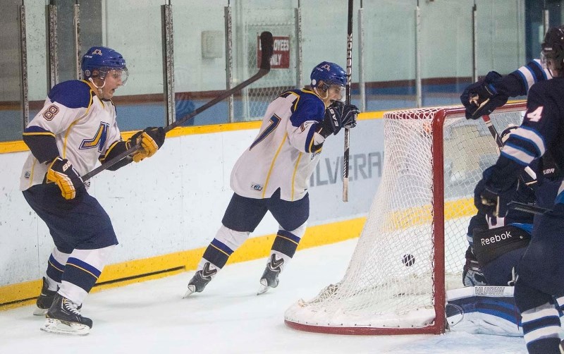 MERCHANTS FILL THE NET &#8211; Brent McGugan (left) and Josh Jewell react to a goal by the St. Albert Merchants against the Morinville Jets in Sunday&#8217;s junior B game at 