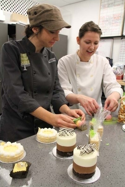 MAKING SWEETS – Lead decorator Jocelyne Leyte (left) and pastry chef Amanda Allan put the finishing touches to their new dessert creations.