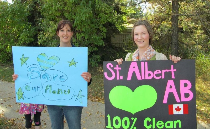 CLIMATE MARCH – St. Albert resident Radelle Rombough (right) organized a march in St. Albert to raise awareness about climate change on Sept. 21. The march was part of the