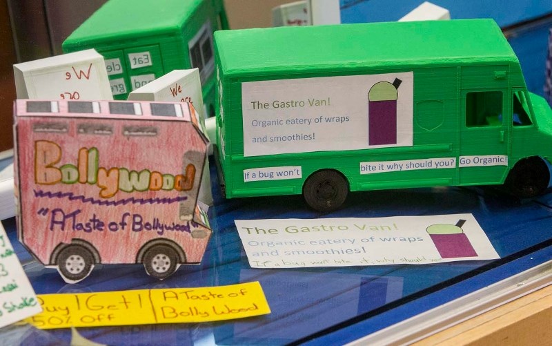 TINY TREATS – Two examples of food trucks made by Vincent J. Maloney students taught by teacher Kelly Montpetit. Montpetit has been teaching a special unit on food trucks as