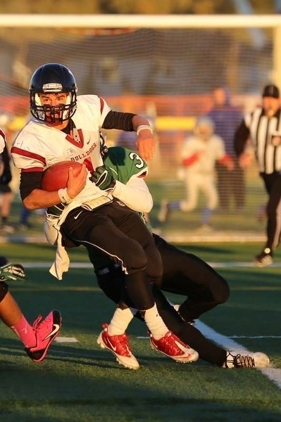 DAWG CAUGHT &#8211; Bellerose Bulldogs quarterback Morgan Sherban is grabbed from behind in Thursday&#8217;s 41-35 win over the Spruce Grove Panthers at Fuhr Sports Park. The 