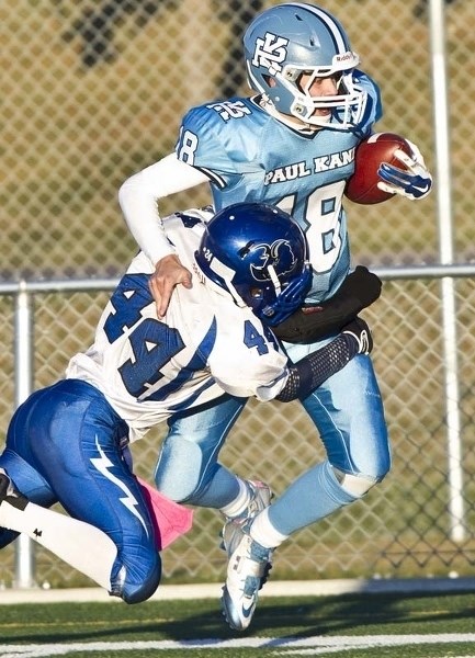 MARKED MAN &#8211; Paul Kane Blues quarterback Brendan Guy is tackled by &lt;br /&gt;Damon Fee of the Ardrossan Bisons in the Miles division two contest Thursday at Riel