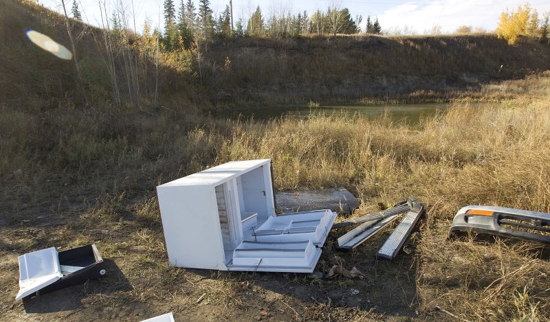 Some of the refuse visible in a pit being used for dumping