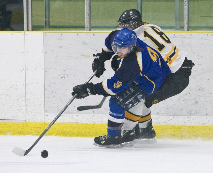 MERCHANTS AT HOME – Blair Macuch controls the puck for the St. Albert Merchants during a home game in the Capital Junior B Hockey League. Friday the Merchants host the Fort