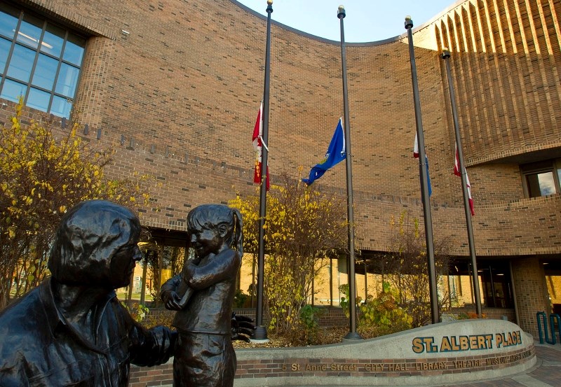 SOLEMN – Flags are at half-mast at St. Albert Place out of respect for the Canadian Armed Forces reservist Cpl. Nathan Cirillo