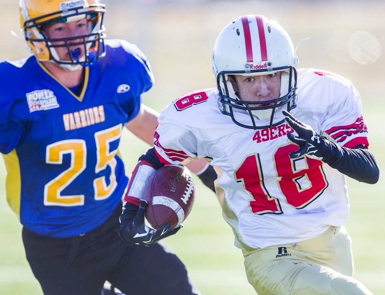 GAINING GROUND – St. Albert 49ers slotback Shoya Lavoie goes for a run against the Wetaskiwin Warriors in the last bantam Tier 3/4 game before the playoffs in the Capital