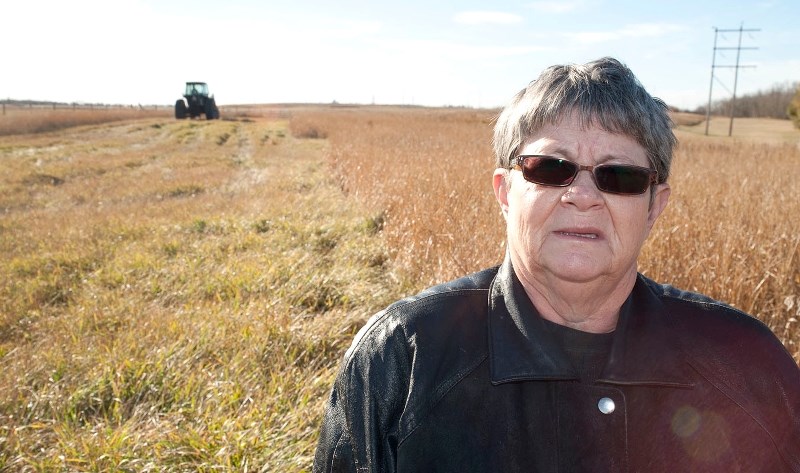 MOWING MOURNED – Akinsdale resident Adeline Andronyk is upset that the province is mowing the grass in the TUC behind her home. She says she made a verbal agreement with the