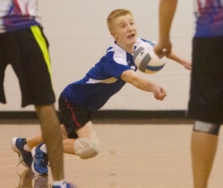 DEFENDING THE COURT – Braeden Kelly of the Paul Kane Blues scrambles to keep the ball in play in Wednesday&#8217;s metro Edmonton division two junior playoff against the W.P. 
