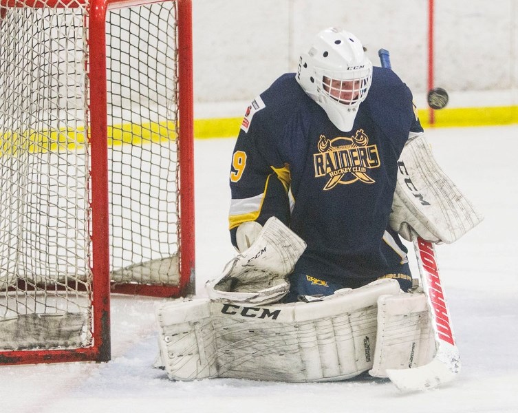 PROTECTING THE NET – Ethan Crotty blocks a shot for the St. Albert Raiders during a game in the Alberta Midget AAA Hockey League. This weekend the Raiders (2-4-4) host the