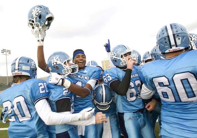 ELATION – The Paul Kane Blues express their delight in repeating as Miles division two champions in metro Edmonton high school football after Saturday&#8217;s 50-45 comeback