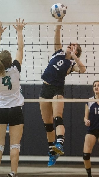 BALL STRIKER &#8211; Hannah Gorgichuk of the Paul Kane Blues pounds the volleyball against the Austin O&#8217;Brien Crusaders in Tuesday&#8217;s metro Edmonton division two