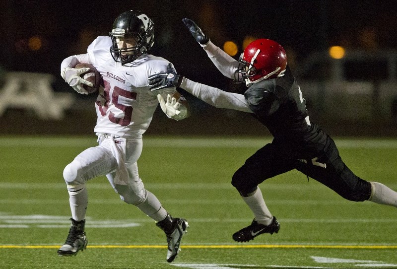 BREAKING AWAY – Zach Nuttall of the Bellerose Bulldogs accelerates towards the endzone on one of his four touchdown runs against the Jasper Place Rebels in Thursday&#8217;s