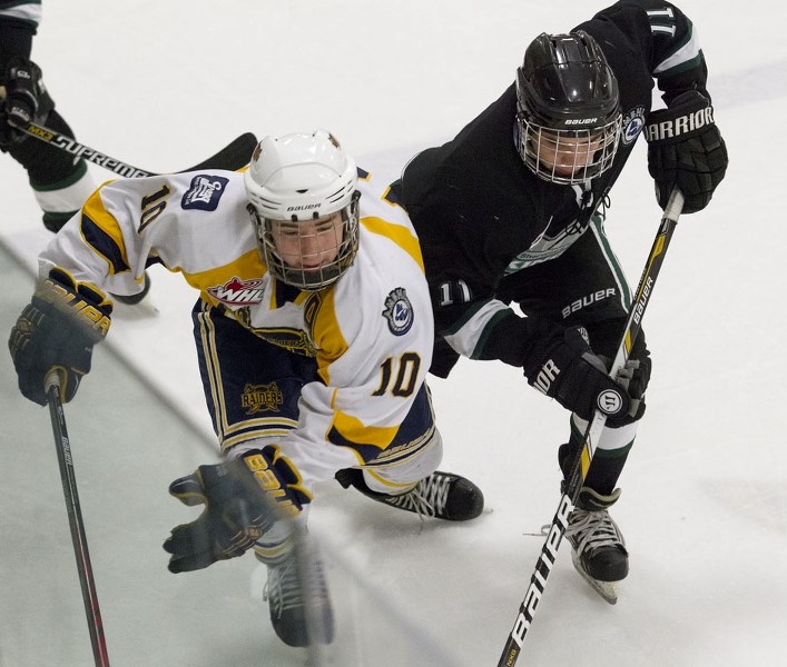 STRIDE FOR STRIDE &#8211; Martin Rudolf (10) of the St. Albert Gregg Distributors Sabres (7-4-3) and Cole Wyatt of the first-place Sherwood Park Flyers (9-2-3) race down the