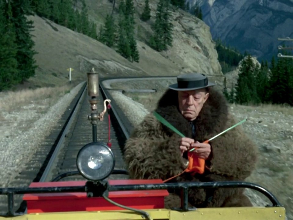 What could be better than a knitter in a bison hide coat on a railway speeder car in the middle of the Rockies? If only there was a spot of tea to be had&#8230;