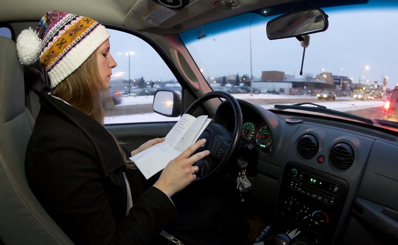 Reporter Viola Pruss drives into Edmonton for the Great Commuter Challenge. While waiting at a red light she rechecks her direction to get to Edmonton City Hall.