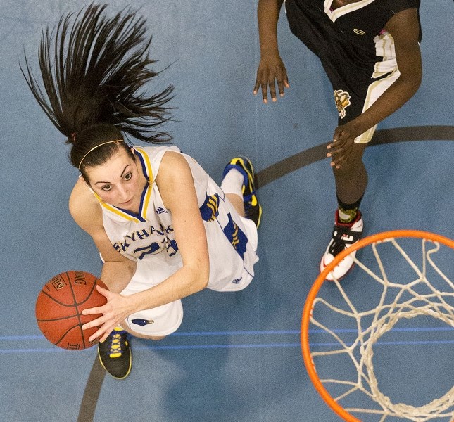 HAIR-RAISING BASKET – Brielle Wise of the St. Albert Skyhawks attacks the hoop in Thursday&#8217;s 97-33 blowout of Luther College of Regina at the 17th annual Mike Dea