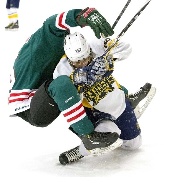 CRUMPLED – Mattias Neset of the St. Albert Crusaders is bent out of shape from a collision in Saturday&#8217;s 8-3 win over SSAC Don Wheaton at Go Auto Arena. Neset sniped