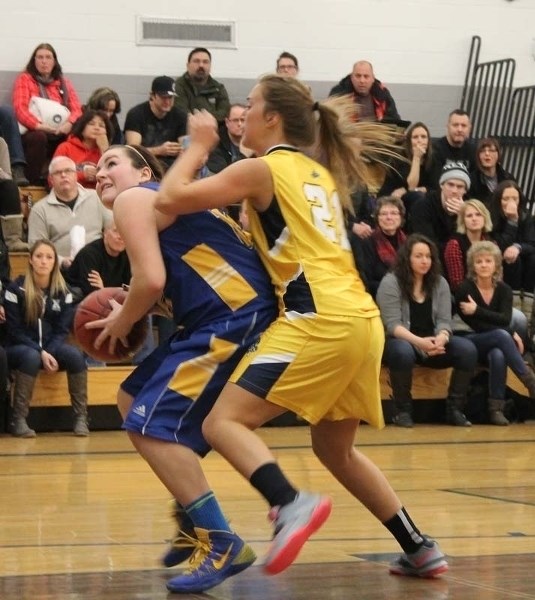 LOOKING TO SCORE – Jessa Ivicak of the St. Albert Skyhawks eyes up the hoop with Summer Schlamp of the Bev Facey Falcons on her back in Saturday&#8217;s final at the 17th