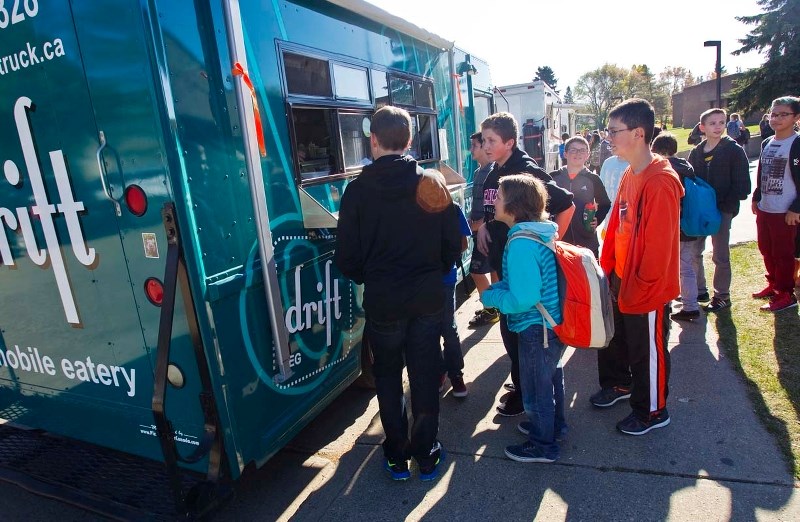 The city is investigating new regulations and licensing to govern mobile vendors such as food trucks.