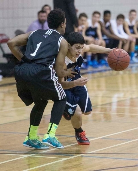SHOWDOWN – Danny Iskander of the Paul Kane Blues works the ball against Darryl Broderick of the Bellerose Bulldogs in Wednesday&#8217;s metro Edmonton division one game at