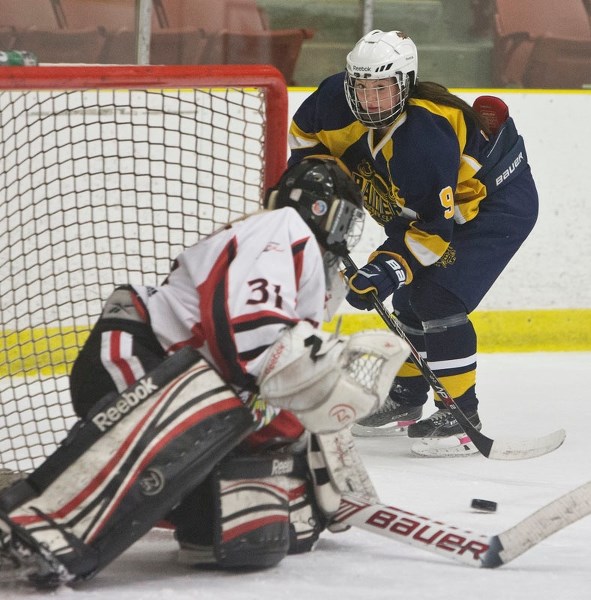 GOAL GETTER – Brandy Steinman of the St. Albert Raiders attacks the net against Chantelle Sandquist of the Red Deer Chiefs in Sunday&#8217;s Alberta Major Bantam Female