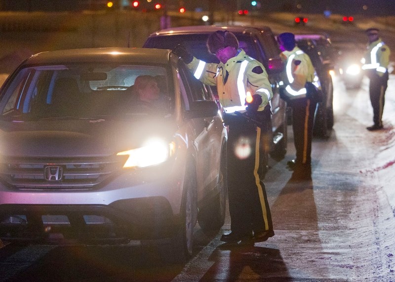 PLAN AHEAD &#8211; St. Albert RCMP flag down vehicles during a checkstop in 2013. Officers are noticing that so far this month
