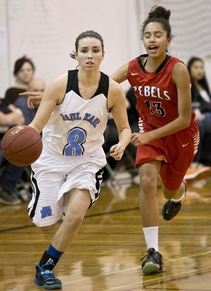 PUSHING FORWARD – Rachel McIntyre of the Paul Kane Blues pulls away from Camille Wilson of the Jasper Place Rebels in Wednesday&#8217;s metro Edmonton division one game at