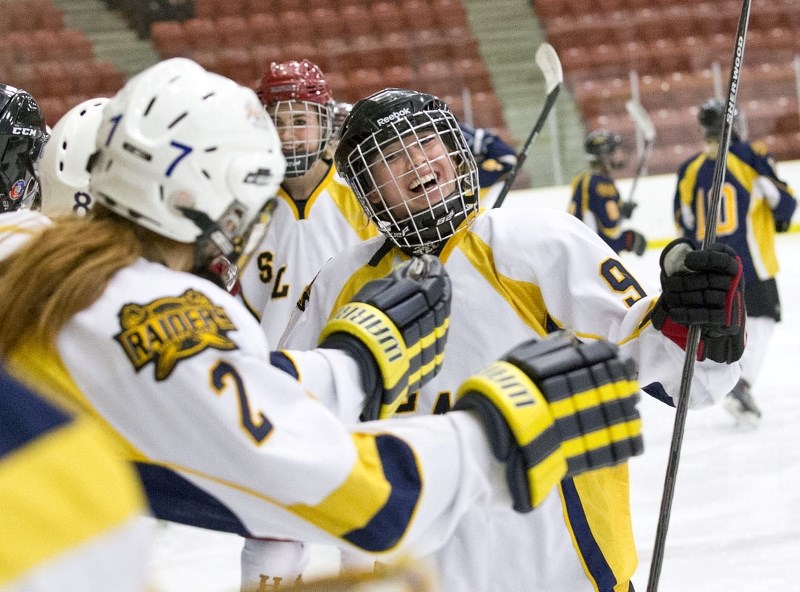 BLAST FROM THE PAST – Matana Skoye celebrates a goal for Team Gold as Haley Kuzyk (2) offers congratulation at the first annual Slash Alumni Event on Sunday at Go Auto Arena. 