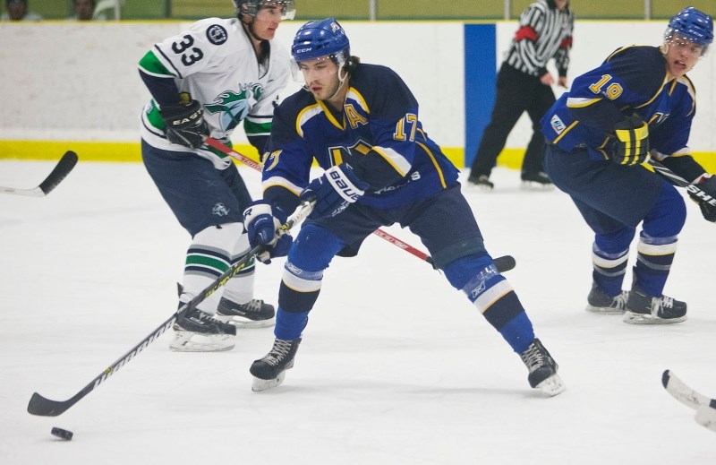 SCORING THREAT – Assistant captain Mike Roeleveld plays the puck for the St. Albert Merchants in Sunday&#8217;s 11-4 drubbing of the Edmonton Mustangs at Akinsdale Arena.