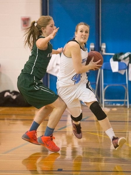 POWER PLAY – Sydney Hurlburt attacks the hoop for the Paul Kane Blues in Saturday&#8217;s final against the Medicine Hat Kwahommies at the Paul Kane Classic. Hurlburt