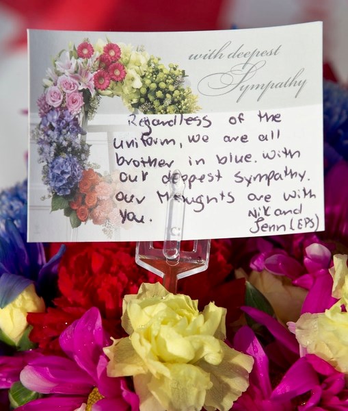 Flowers at the RCMP detatchment on Monday following Saturday&#8217;s shooting of two St. Albert RCMP officers.