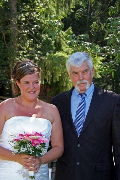 RCMP DAUGHTER – Tamara Asay and her father at her wedding in 2011. She says the families of RCMP officers
