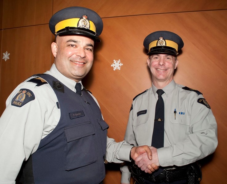 THE HAND-OFF – Outgoing Morinville RCMP commander Sgt. Mark Mathias