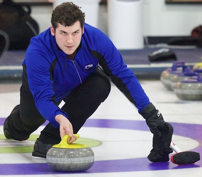 AIMING FOR THE BROOM – Evan Asmussen eyes up a delivery for the Greg Pasichnuk rink in Sunday&#8217;s A final at the Solo Liquor Stores Mixed Bonspiel. Pasichnuk needed only