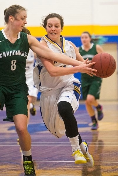 DRIVE TIME – Sam Dargis of the St. Albert Skyhawks attempts to push the ball past Isabel Rattai of the Medicine Hat Kwahommies in Saturday&#8217;s semifinal at the fourth