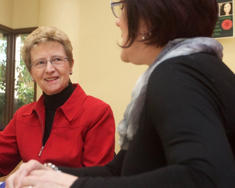 Facilitator Stella Shewchuk of STAR Literacy works with student Louise Savard