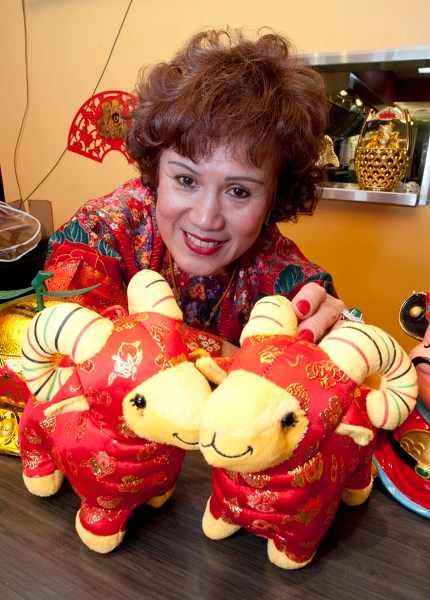 YEAR OF THE SHEEP – Amy Quon of St. Albert&#8217;s Lingnan Express shows off some of the many decorations that will grace the restaurant this month as part of Chinese New