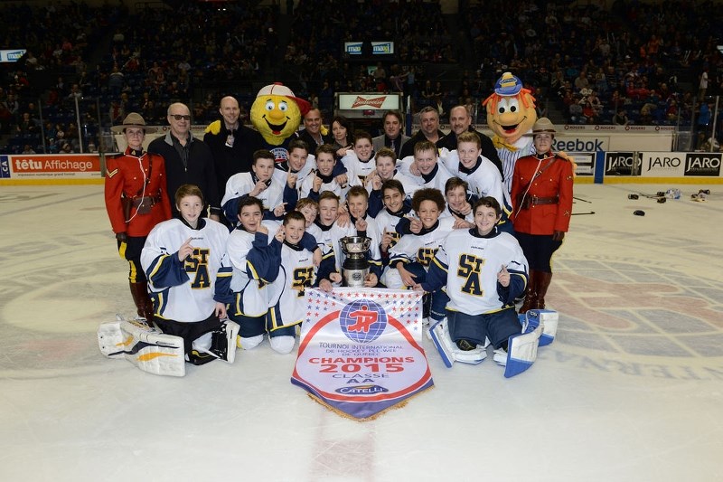 HOMETOWN HEROES &#8211; The peewee AA St. Albert Sabres are the champions of the 56th annual Quebec Peewee International Hockey Tournament after knocking off the Brandon