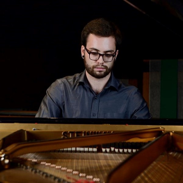 Pianist Spencer Kryzanowski rehearses for his upcoming recital at Don&#8217;s Piano Place on Saturday