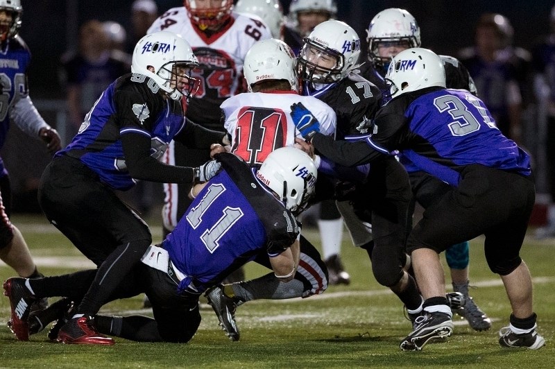 GANG TACKLE – From left to right: Matt Heinrichs
