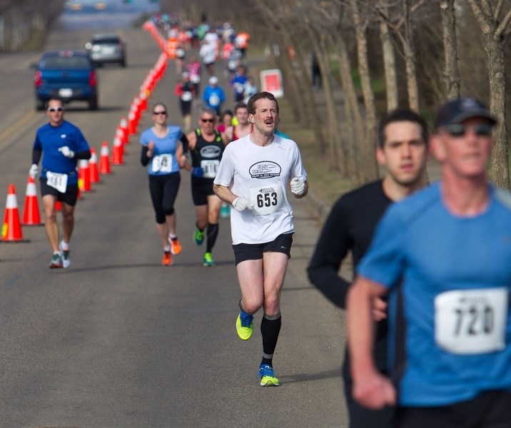 ROAD RUNNERS &#8211; Runners work their up Levasseur Road in the south section of the first leg of the Tech Shop 10-miler in the Landrex St. Albert Road Race on Sunday.