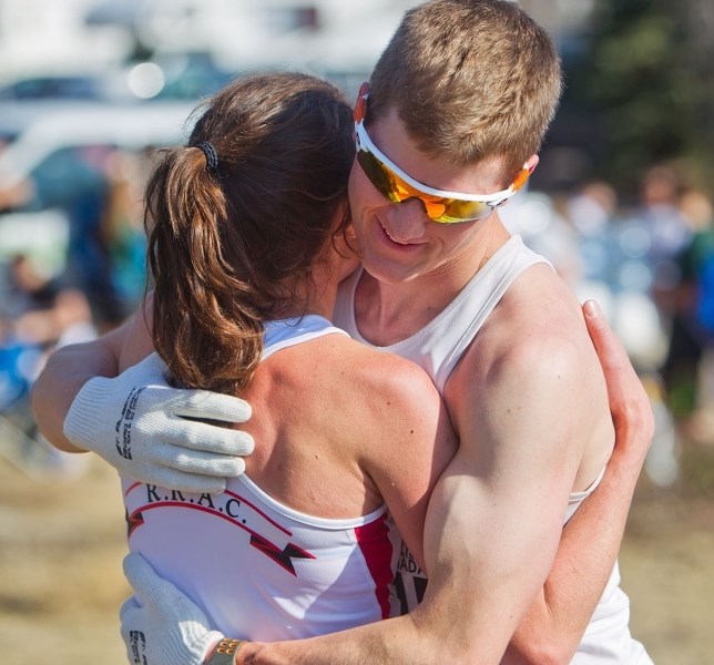 HUGGING IT OUT – Matt Setlack greets his wife