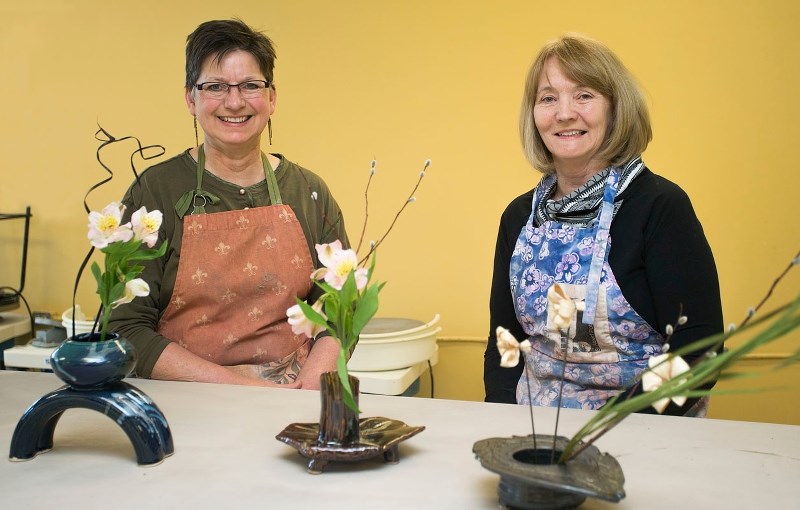 Members of the Potters&#8217; Guild prepare Ikebana pots in advance of their annual sale